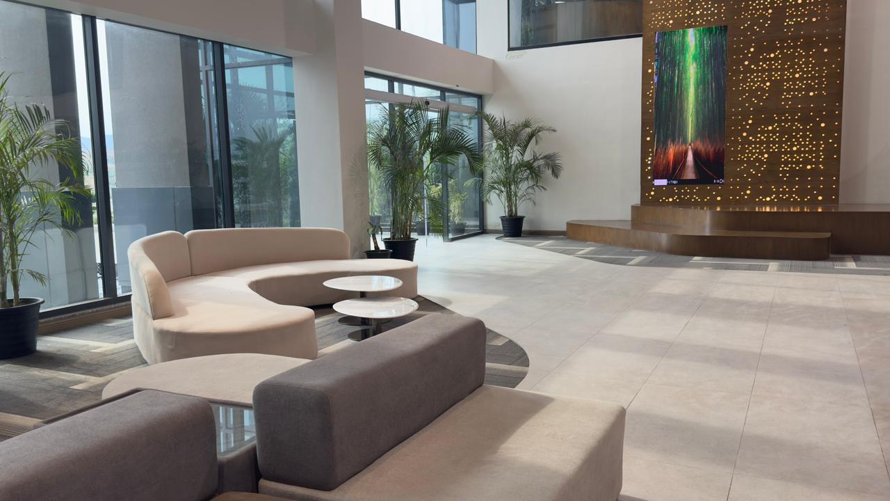 Lobby area at Silicon Village Smart City Capital with LED chairs and modern reception setup