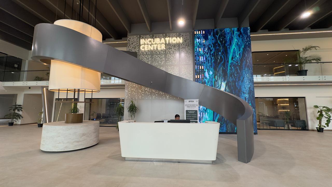 Reception desk in lobby at Silicon Village Smart City Capital with modern counter and welcoming setup